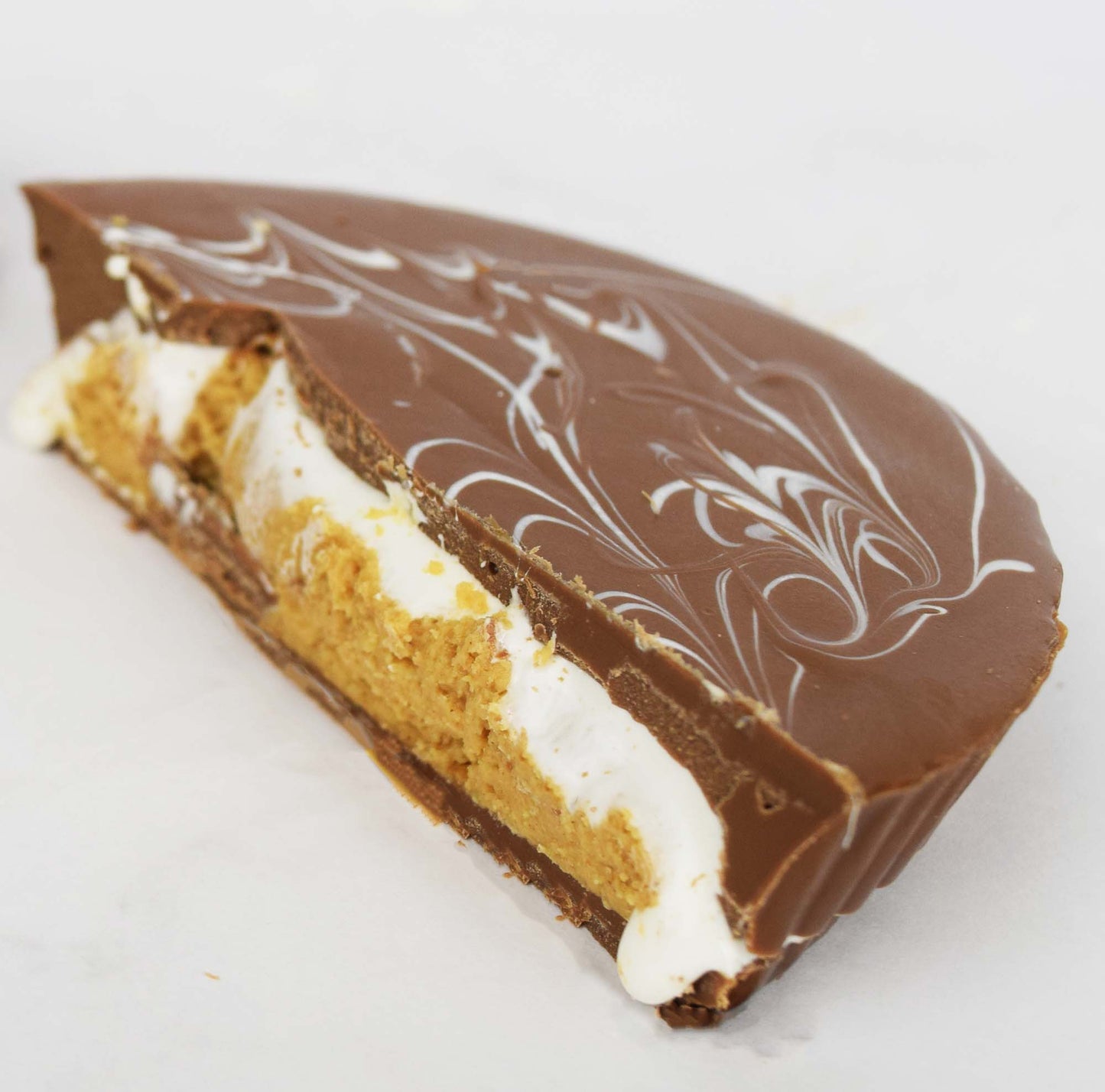 Milk Chocolate Peanut Butter Cup Cut in Half to Reveal Peanut Butter and Marshmallow Fluff Filling