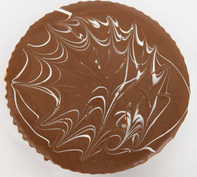 White Chocolate Design on Top of Milk Chocolate Peanut Butter Cup