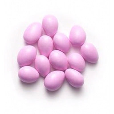 Pastel pink Jordan almonds on a white background.