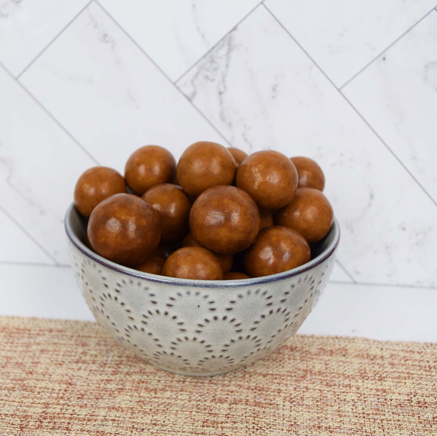 Peanut Butter Milk Chocolate Malt Balls in Decorative Ceramic Bowl
