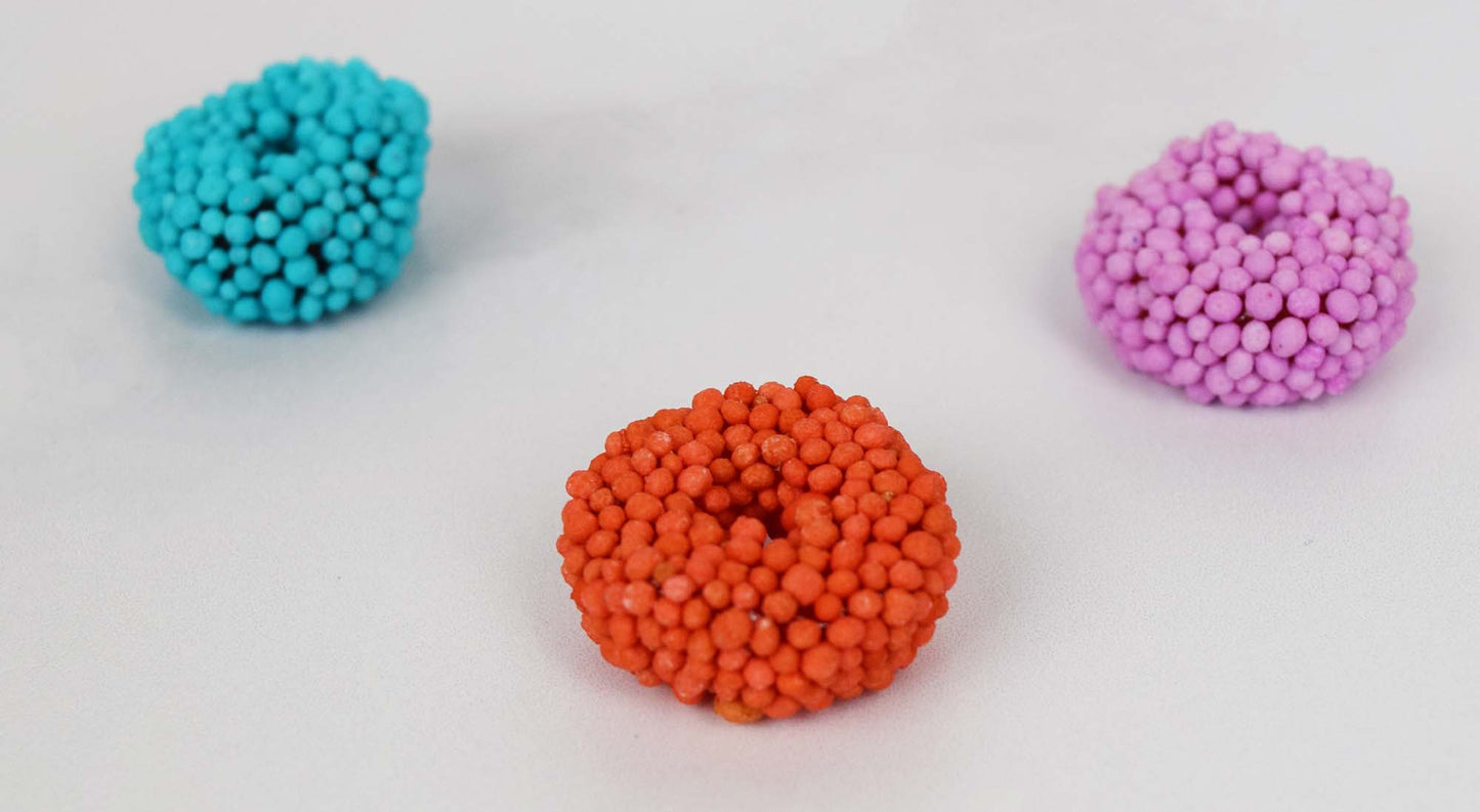 Closeup of Individual Blue, Red, and Pink Cosmic Gummi Rings