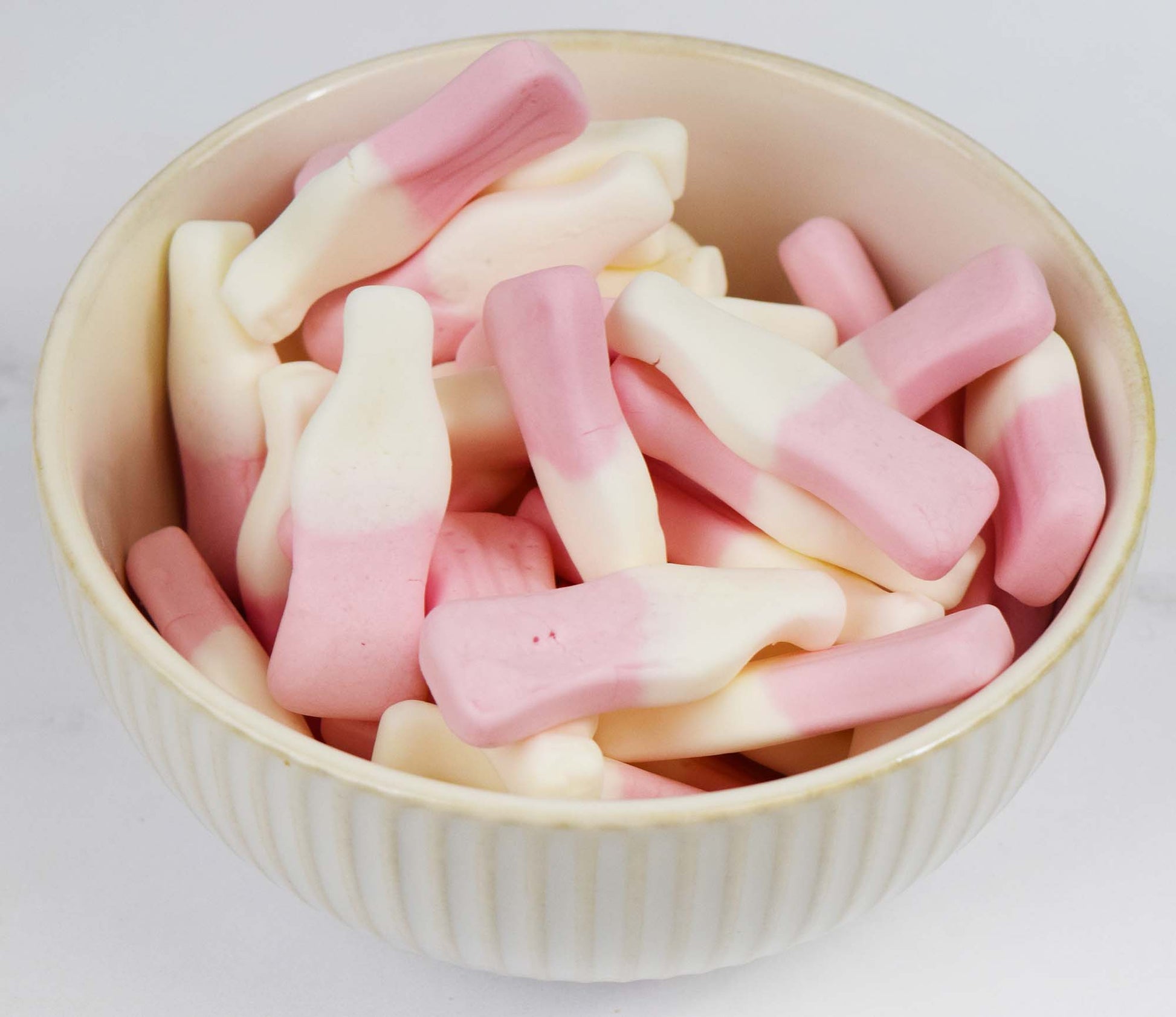 Strawberry Milkshake Candy Bottles in Decorative Ceramic Candy Bowl