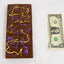 Dubai Chocolate bar next to a one-dollar bill 
