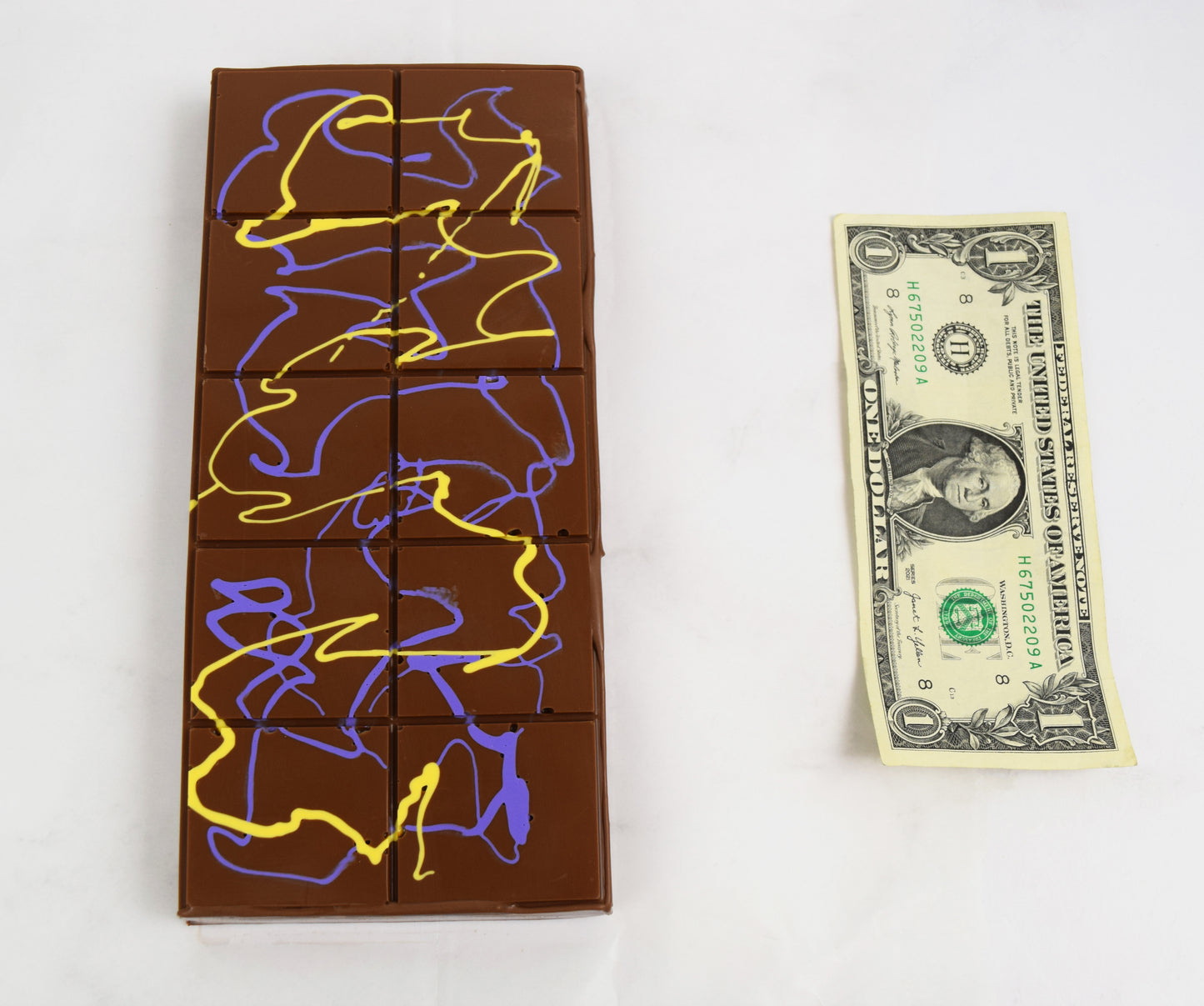 Dubai Chocolate bar next to a one-dollar bill 