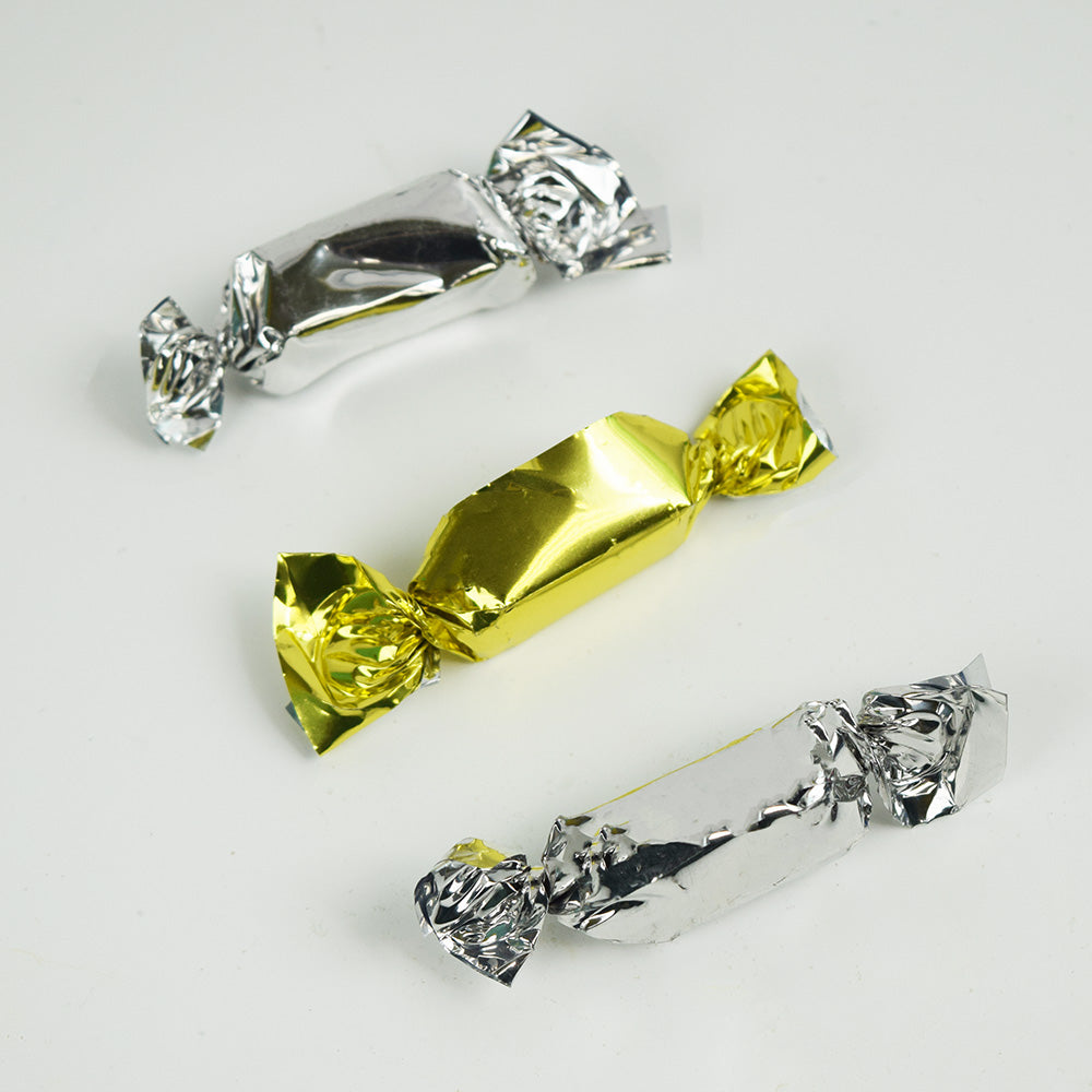 Two silver and one gold coffee prims